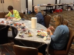 Making found-object flowers for a mosaic panel at SAMA 2014 in Houston, Texas