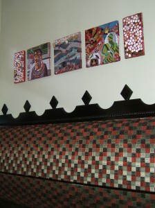 A New Orleans themed mosaic by Lynn Bridge hanging in a room